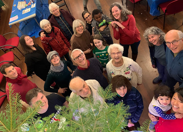 members around christmas tree