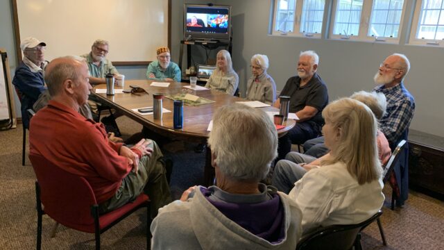 Humanist group seated around a table