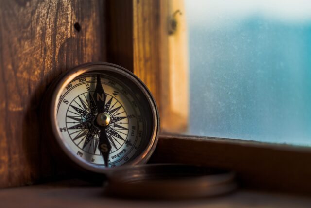 compass on a window sill
