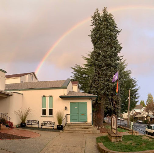 Building with a rainbow over it