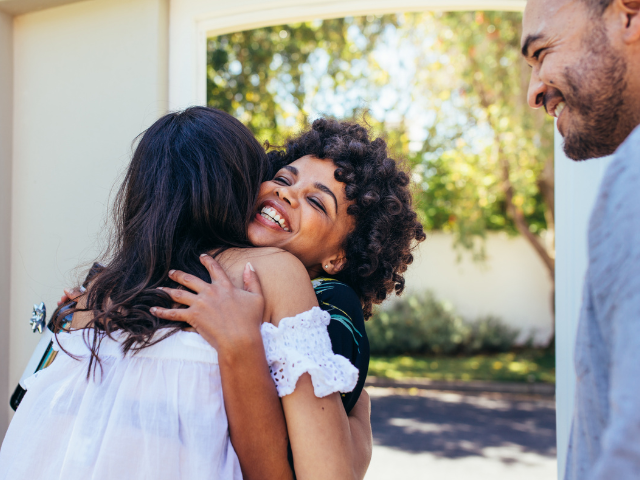 two women hugging and smiling